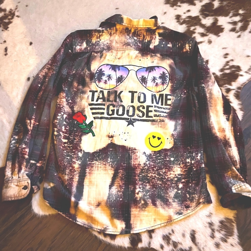 Women’s tie dyed flannel with TALK TO ME GOOSE patchwork on the back